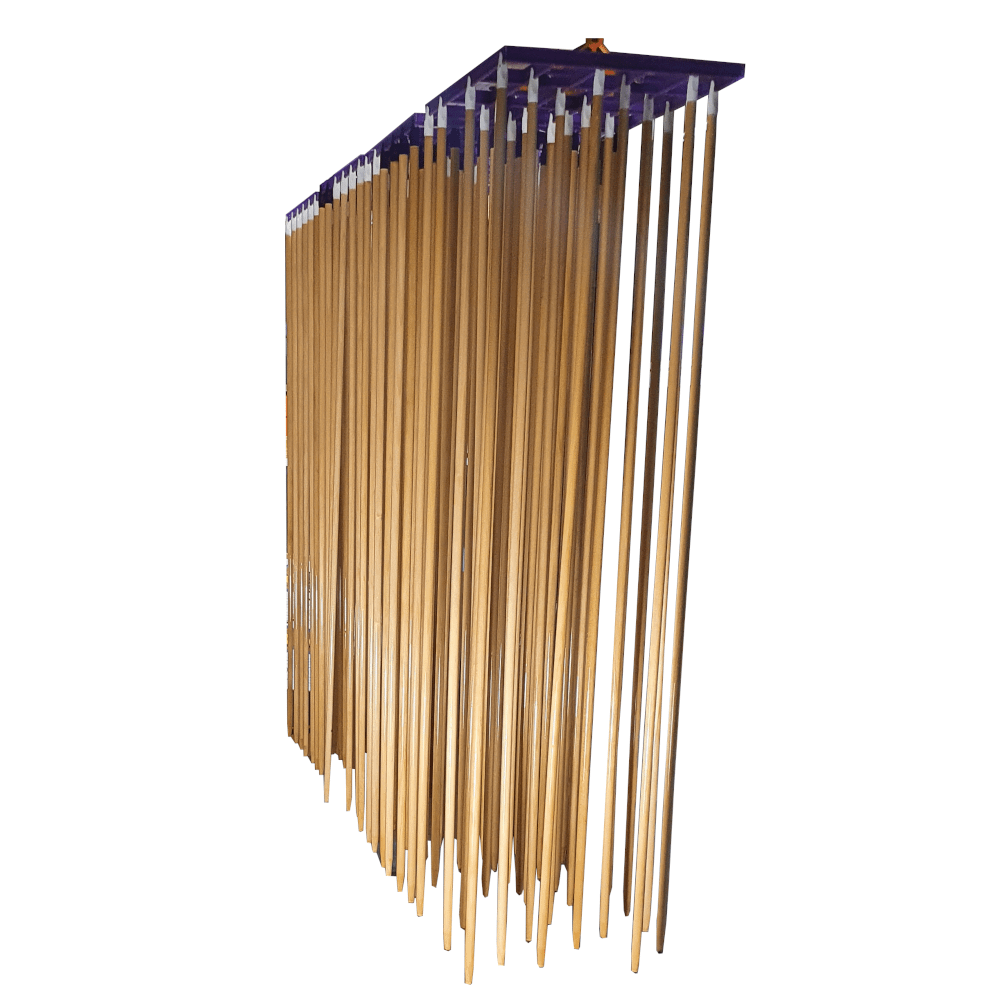 Wooden arrows hanging to dry after being dipped in a protective polyurethane finish, enhancing durability and aesthetics.