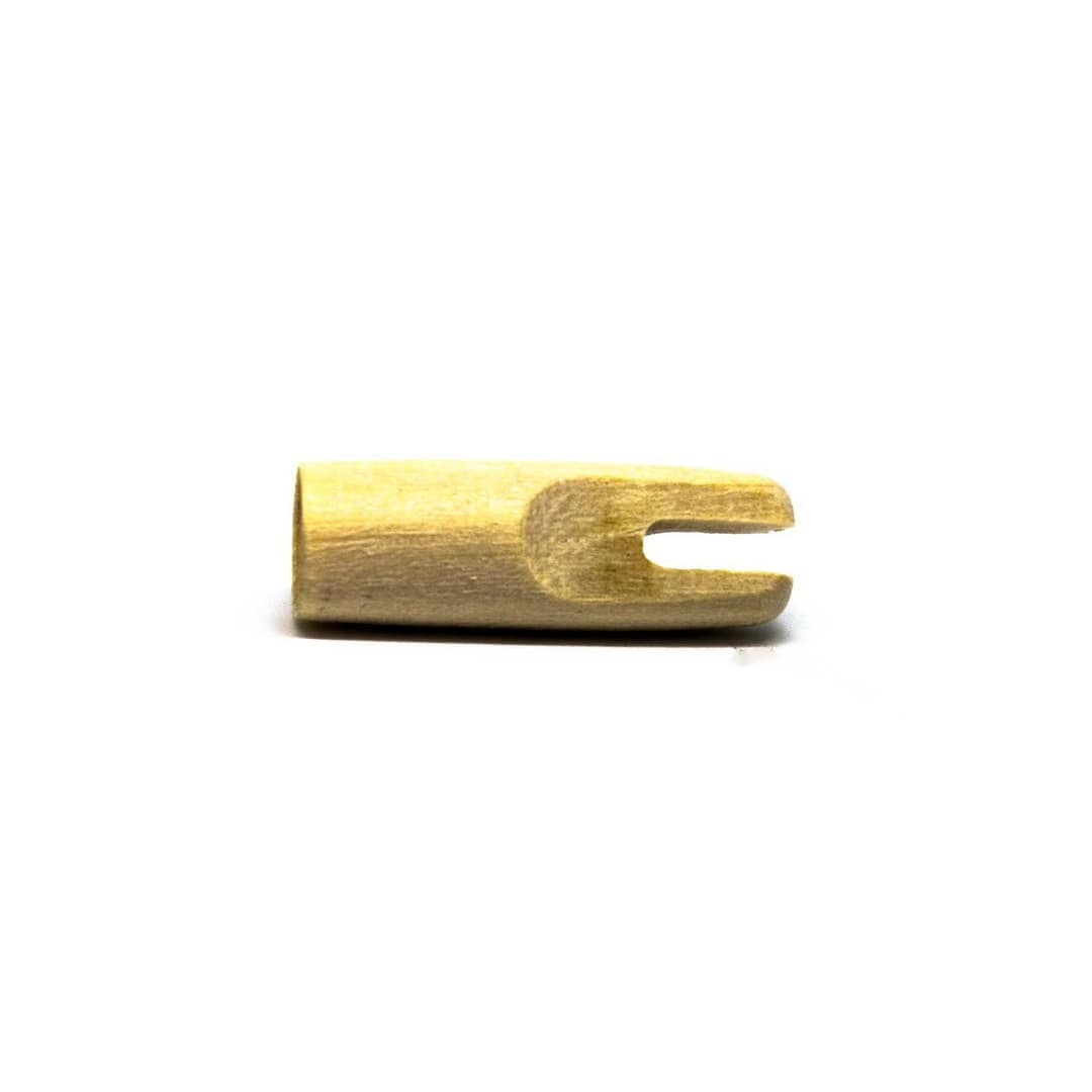 A Slim Wood Nock (Glue-On) designed for wooden arrows, featuring a lightweight, durable construction for smooth arrow release and optimal alignment in traditional archery.