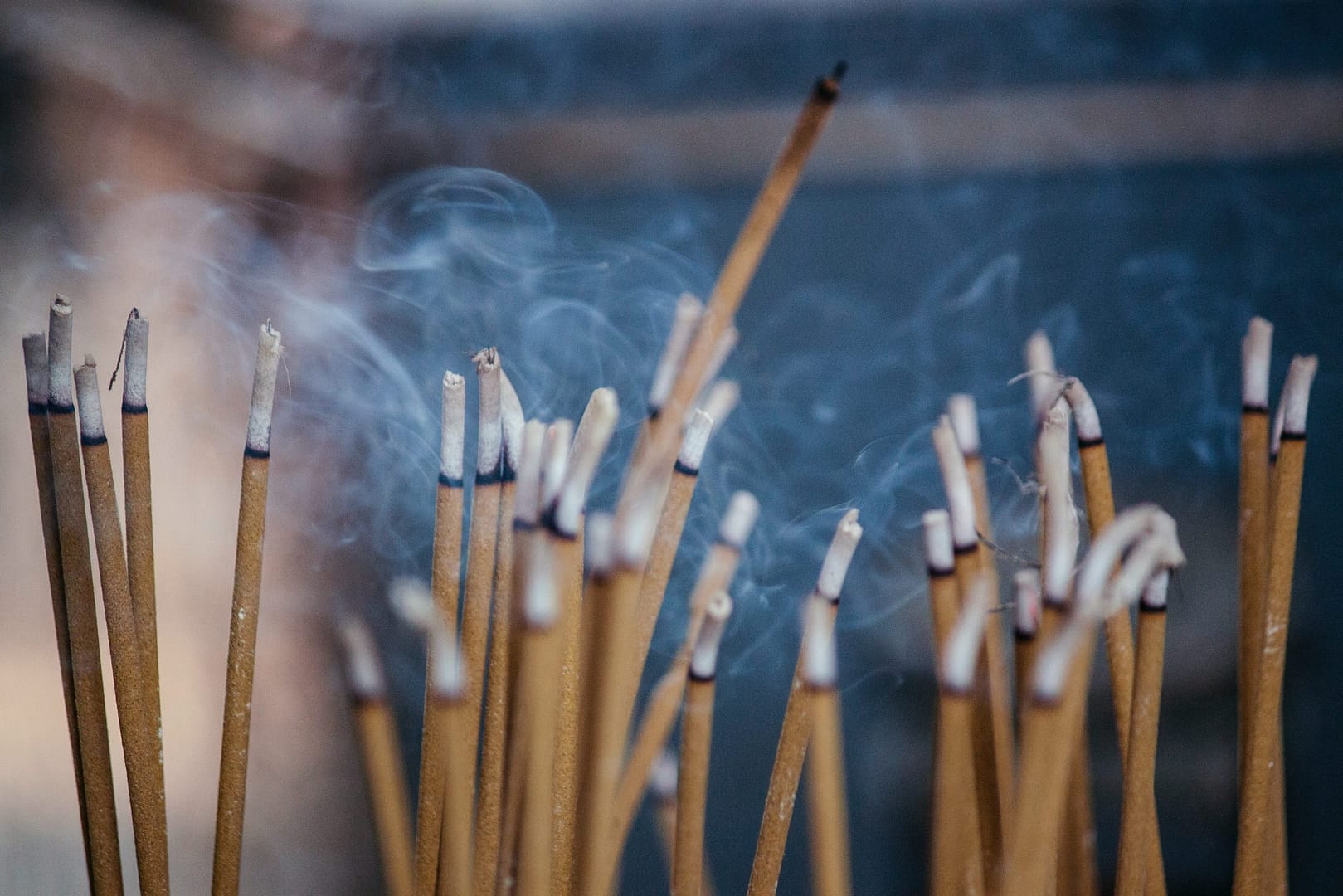Incense burning in a calm, candle lit corner of a bedroom