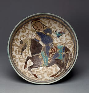 Painted bowl showing a Seljuk prince riding a horse, with a bow on his side. Historical Archery depiction