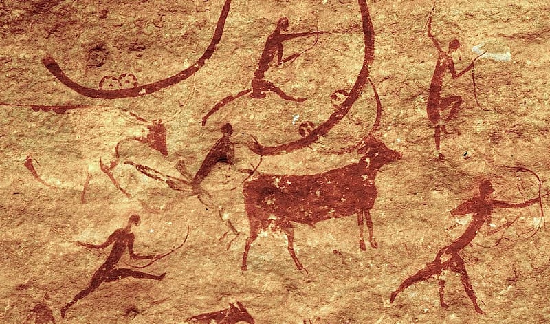 Cave drawing featuring Humans hunting animals using traditional bow types