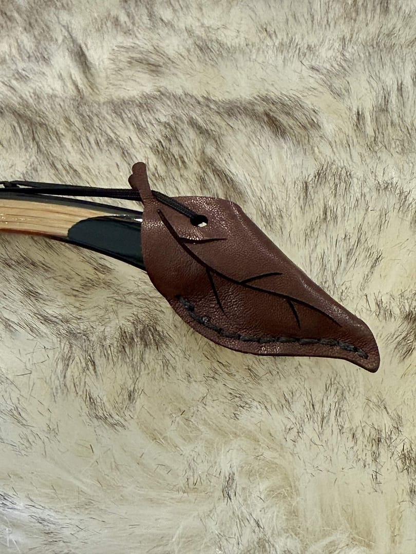 Solkarra kangaroo leather string keeper, leaf shaped tip cap with arrow button, view 3